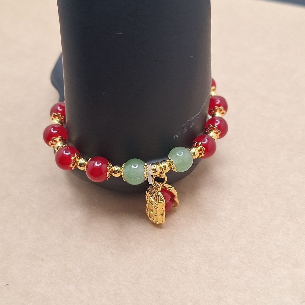 Elegant Red Beaded Bracelet with Gold Peanut